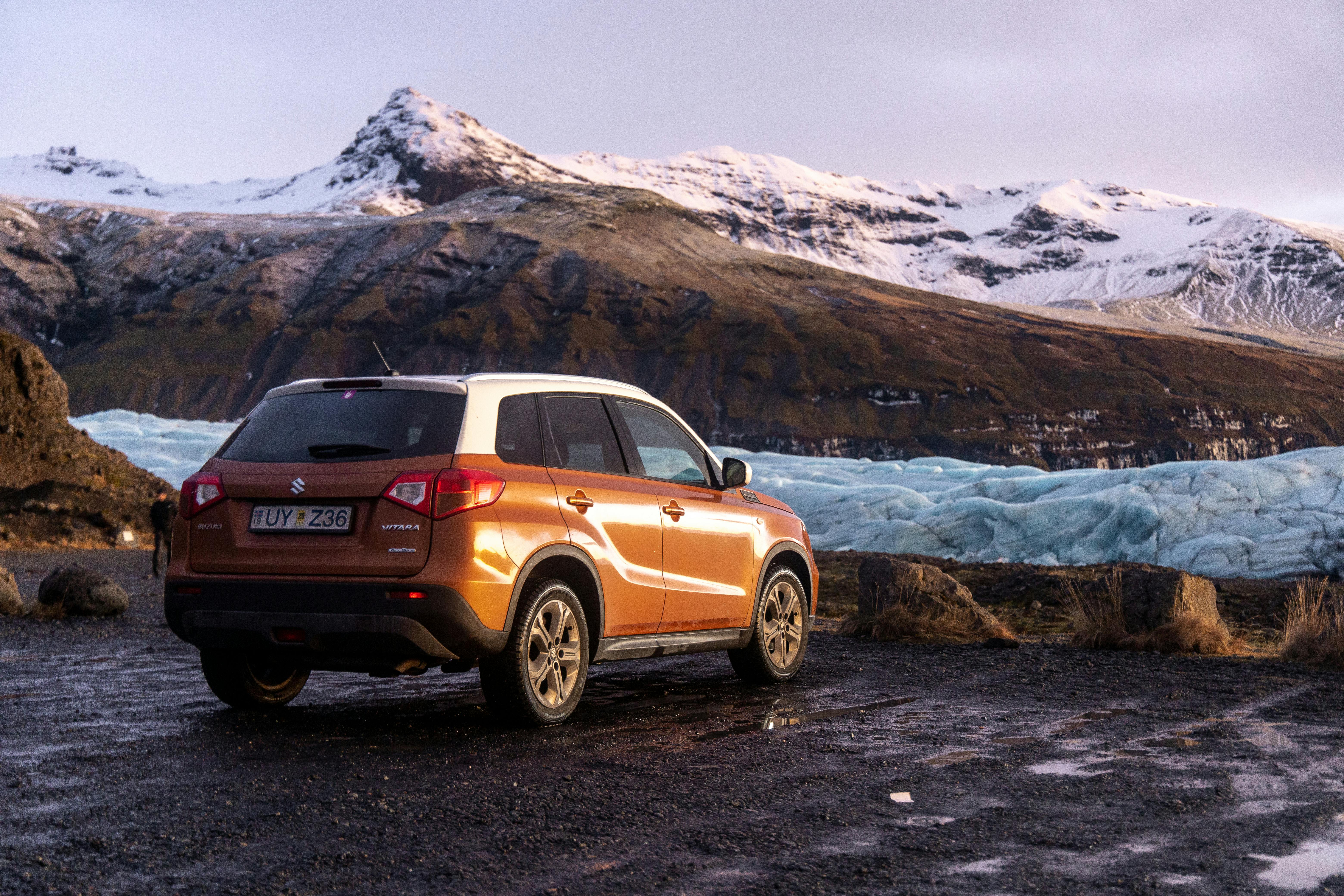 One of icetaxis vehicles parked up overlooking the vast mounain regions of Iceland